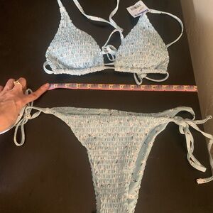 NWT baby blue tanga bikini with padded triangle top with white flowers Large